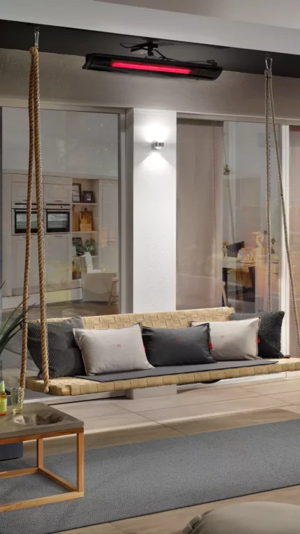 Heatscope Pure 3000W Radiant Heater ceiling-mounts above a cushioned private terrace, delivering silent infrared patio warmth.